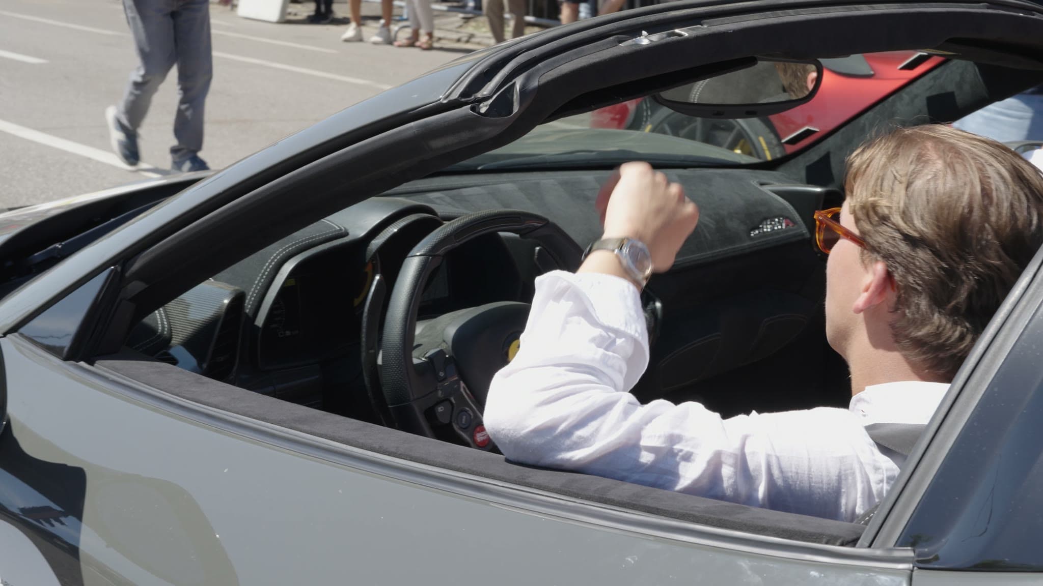 Driver in a convertible sports car